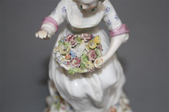 A Chelsea figure of a lady holding a flower basket, c.1765, H. 17.5cm